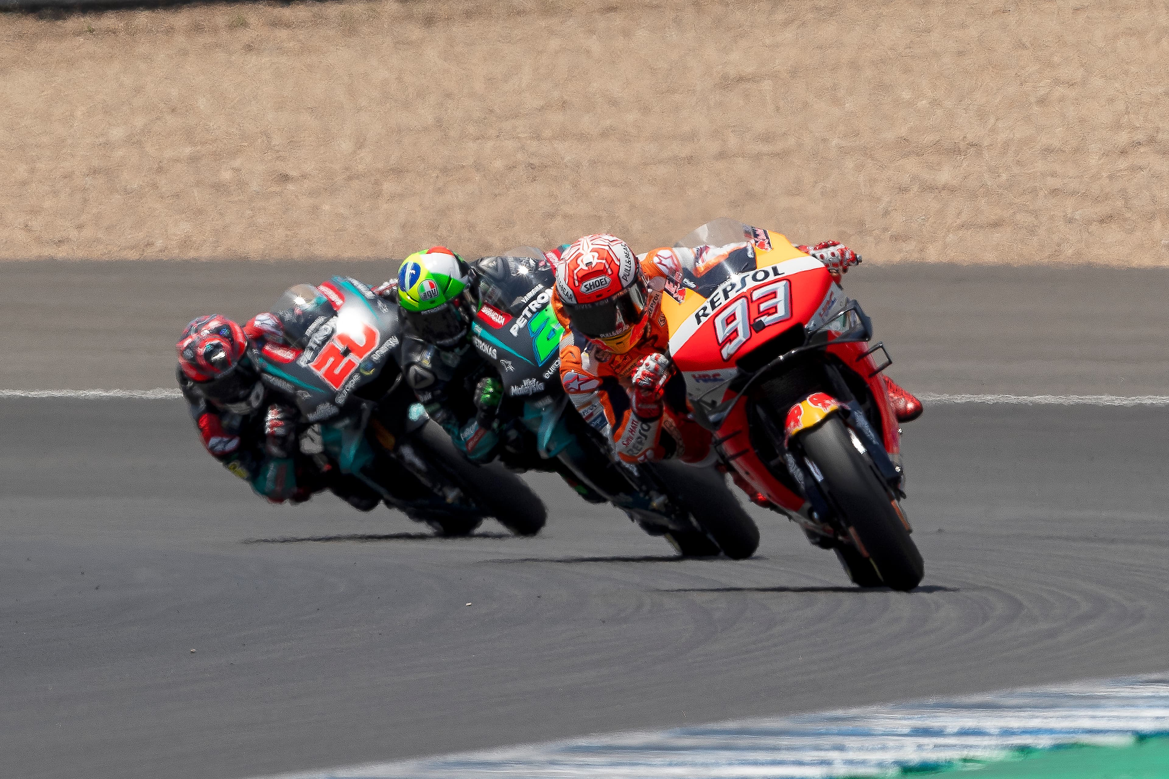 Marc Márquez, riding his Repsol Honda, being followed by the Petronas SRT Yamaha's of Franco Morbidelli and Fabio Quartararo at the 2019 Spanish Grand Prix.
